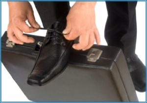 Lacing up shoes on a briefcase
